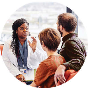 doctor consulting parent and child