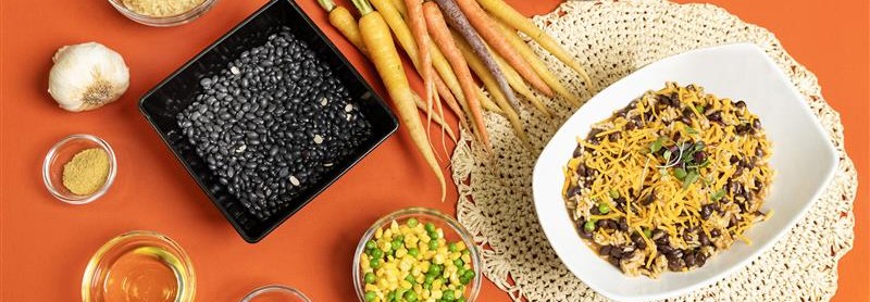 ingredients to skillet recipe with orange background