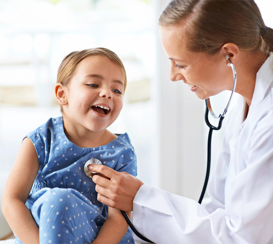 Doctor checking a child heart beat